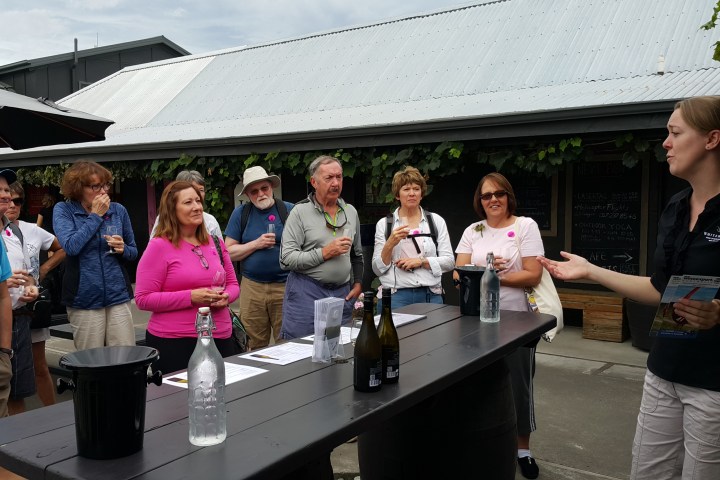 a group of people standing in front of a building