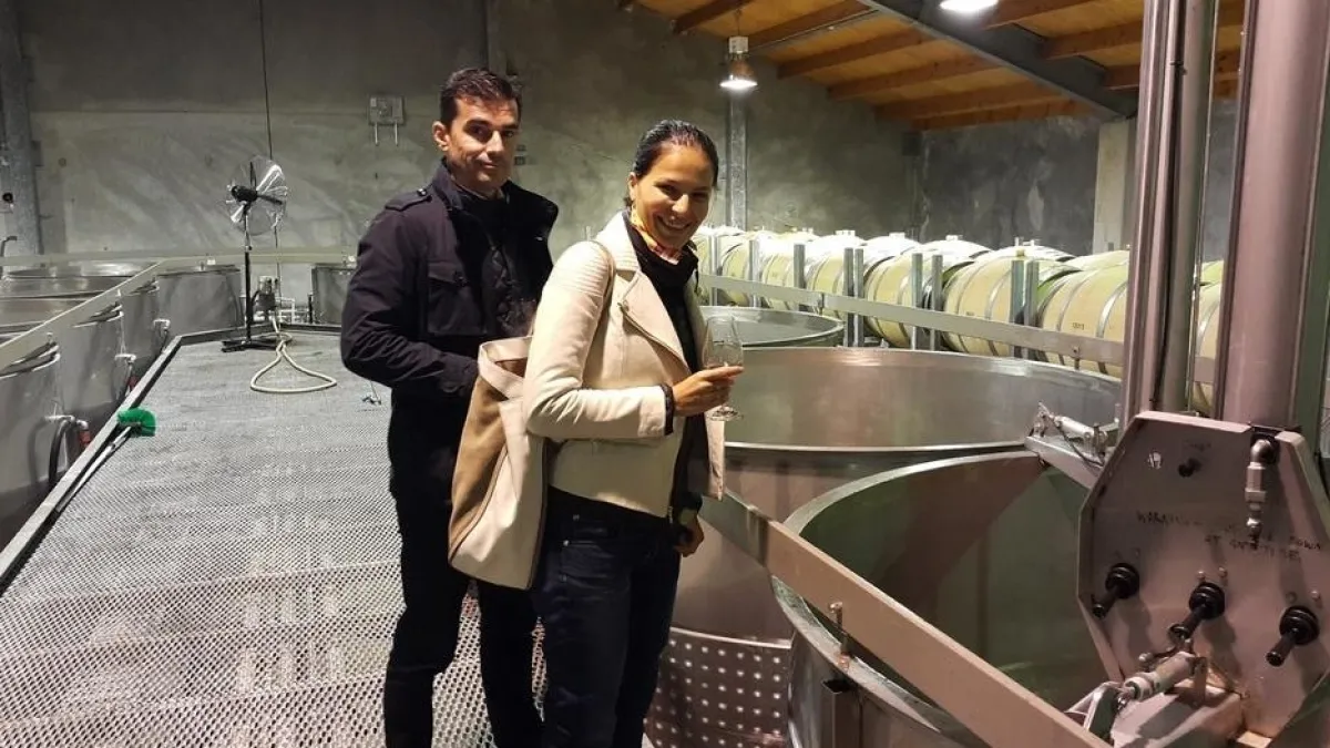 a man standing next to a train