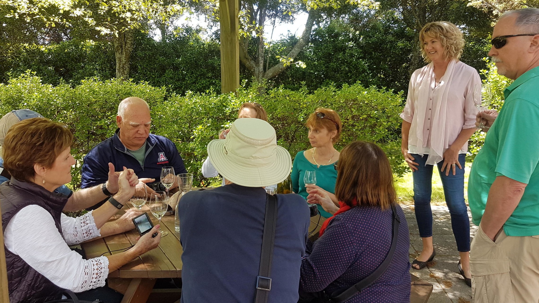 a group of people sitting at a park