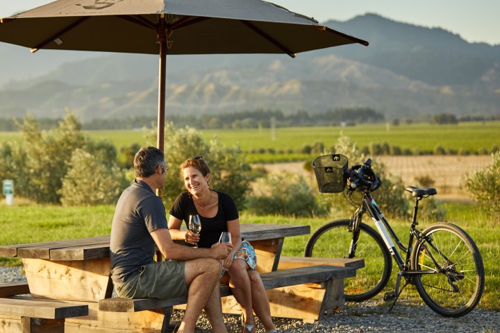 a man and a woman sitting on a bench